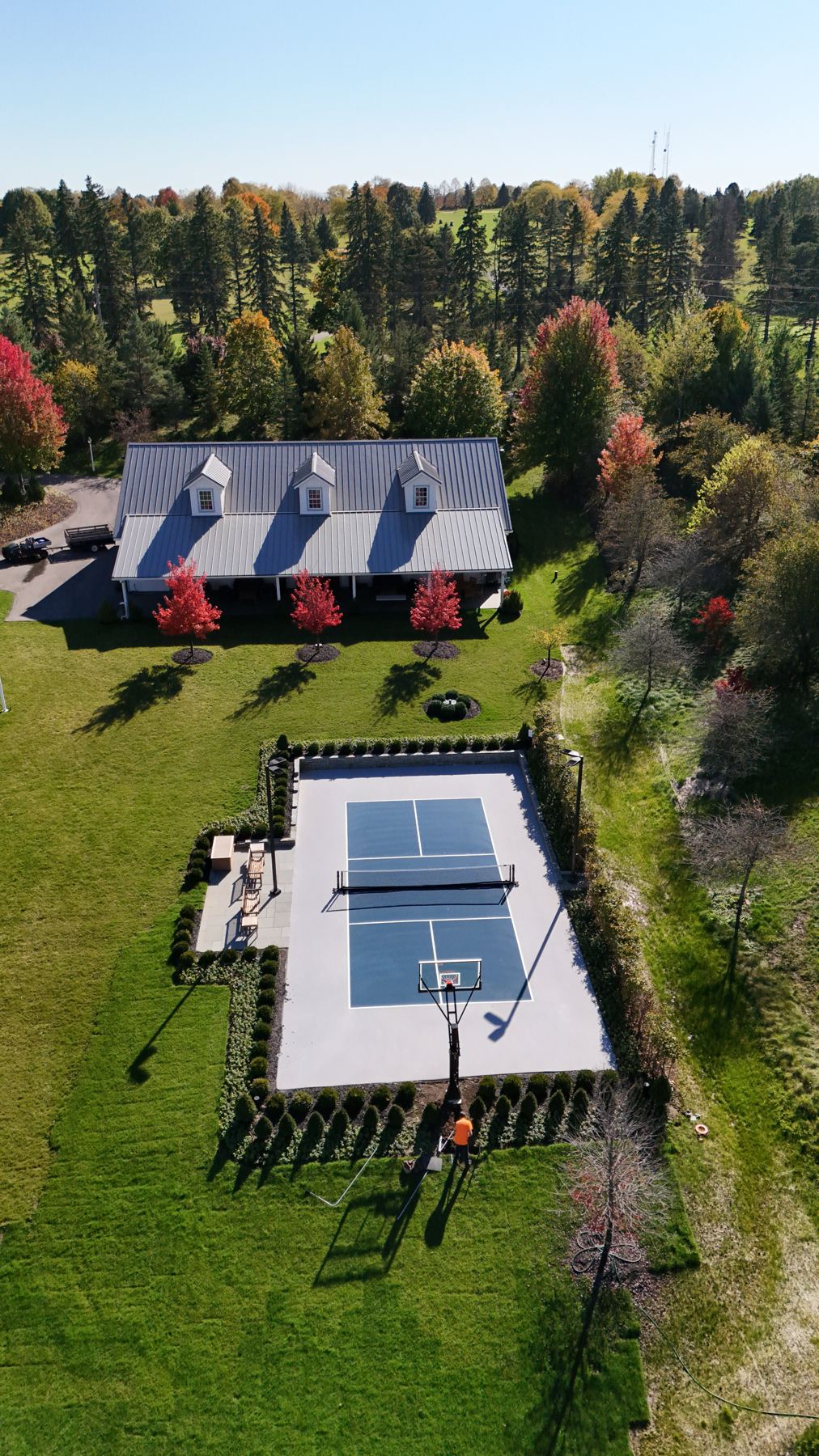 Aerial view of the court, patio and hedges in autumn